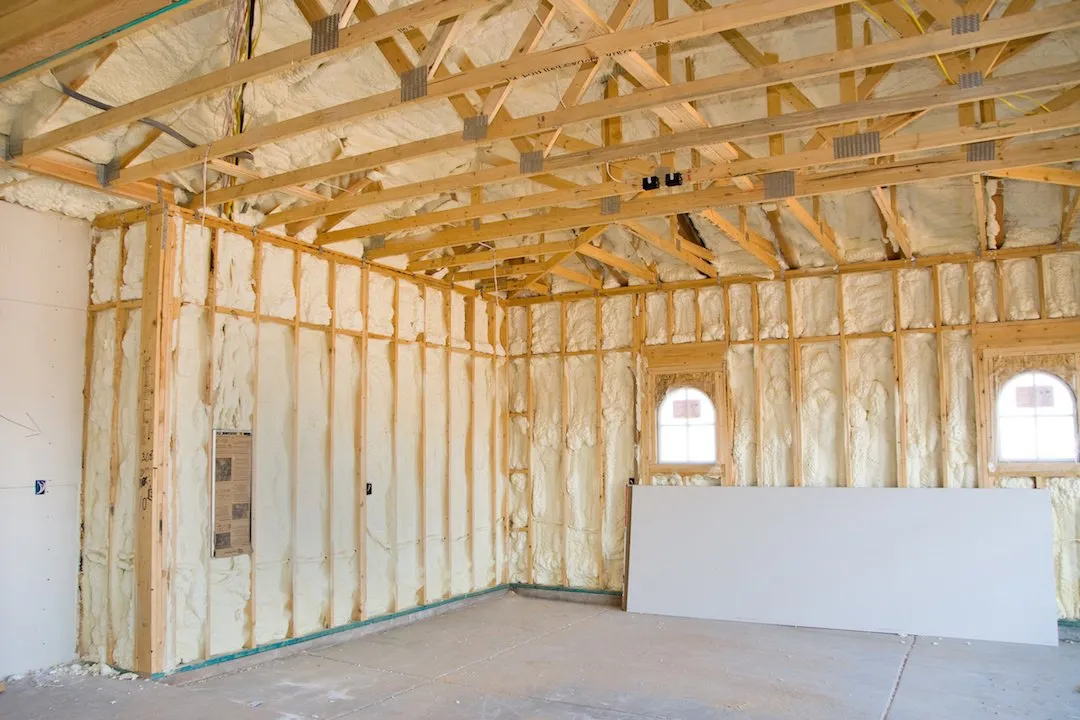 Spray foam insulation in a finished building assembly